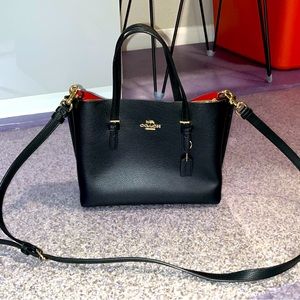 Coach bag with strap can be used as a handbag or a side bag MINT CONDITION !!